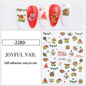 Close-up of Christmas nail stickers with snowman and gingerbread man designs