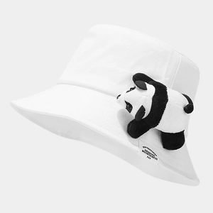 Detail of white cotton canvas bucket hat featuring 3D panda plush and NEW TERRITORIES tag