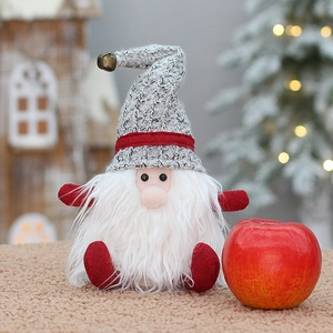 Handmade Christmas gnome gift bag in grey and red knit fabric with festive apple prop