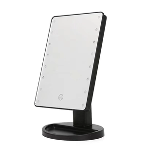 Black LED makeup mirror with 360-degree rotation, touch sensor and round base tray