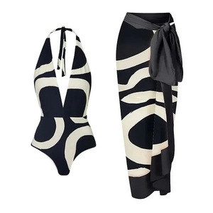 Detail of high waist bikini and matching wrap skirt with black and white geometric print
