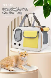 Detail of breathable mesh window and yellow pocket on canvas pet carrier bag