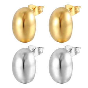 Detailed view of glossy gold and silver bean stud earrings with high-polish finish
