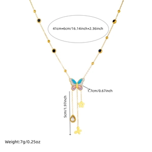 Golden stainless steel necklace with colorful butterfly pendant and floral charms on white background