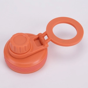Detail of an orange insulated bottle lid with a magnetic phone holder and carry handle