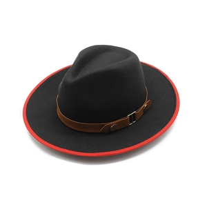 Close-up of black fedora wool hat featuring red brim trim and leather belt with metal buckle