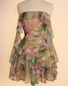 Detail view of tiered ruffles and floral chiffon texture on a strapless dress