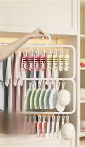 Macro detail of multi-layer laundry rack with removable clips for socks and small items