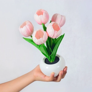 Detailed view of pink LED tulip night light with 5 flowers in a white ceramic pot
