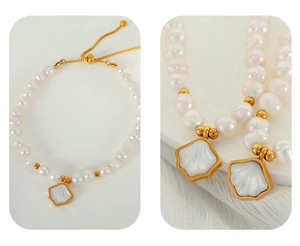 Macro shot of elegant white pearls and a golden shell pendant on a delicate bracelet