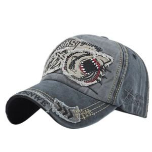 Vintage washed grey baseball cap with shark embroidery and distressed details in 45-degree view