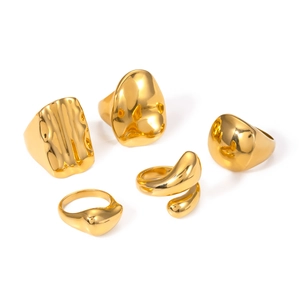 Macro detail of five organic polished gold rings showing liquid metal texture and finish