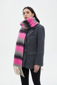 Detail of soft thick striped scarf with long fringe tassels in pink, grey and black