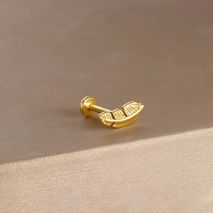 Golden feather design labret stud earring in stainless steel with detailed texture