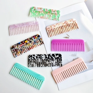 Set of wide-tooth cellulose acetate hair combs with elegant marble and amber patterns