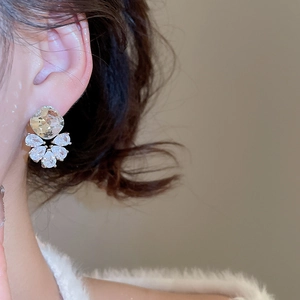 Macro view of sterling silver cubic zirconia stud earrings with teardrop crystal clusters