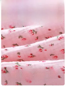 Macro detail of breathable Class A floral cotton fabric for baby girls' clothing