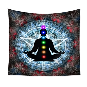 Detailed view of Seven Chakra symbols and black silhouette on a meditation tapestry