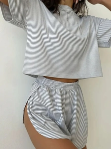 Detailed macro view of gray and white striped knit fabric and elastic waistband on shorts