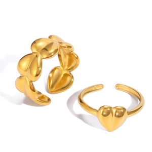 Golden heart-shaped open ring set featuring wide linked hearts and slim single heart band