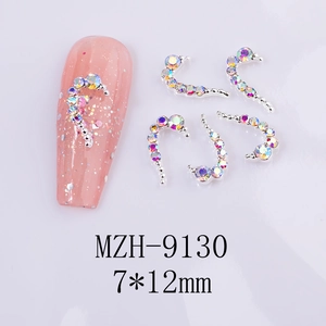 Detail of 7x12mm curved heart nail charms with AB rhinestones on pink glitter nail