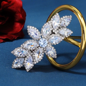 Detailed close-up of large silver hairpin with sparkling leaf-shaped cubic zirconia
