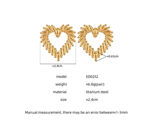 Macro view showing geometric textured gold heart earrings in 18k titanium steel