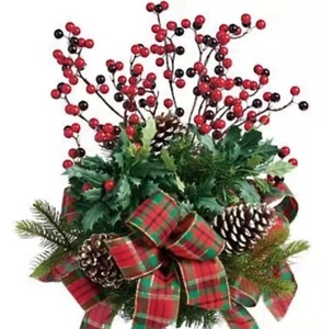 Christmas tree decoration with pine cones, red berries and green plaid ribbon bow