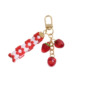 Cute strawberry keychain with red resin charms and embroidered white floral strap