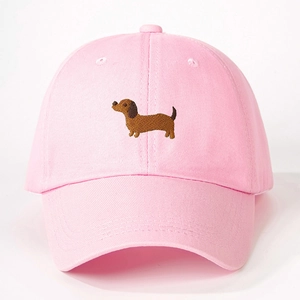 Pink cotton baseball cap featuring embroidered brown dachshund with adjustable back strap