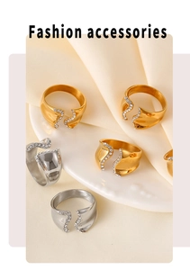 Detailed view of wave-shaped open rings in gold and silver finish with zircon inlay