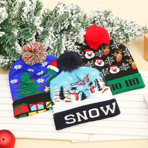 Three LED knitted Christmas hats with Santa, snowman and reindeer festive patterns