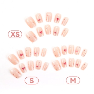 Press-on nail set with red hearts and colorful dots in XS, S, and M sizes