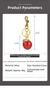 Detail showing dimensions of red glitter apple keychain with gold alloy finish