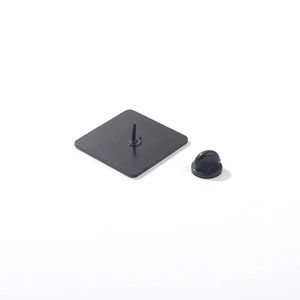 Detail view of a matte black square alloy brooch pin base with secure rubber clutch backing