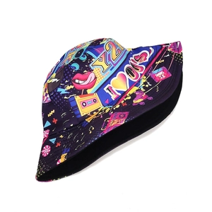 Close-up of Y2K pop art bucket hat featuring vintage cassette and lip prints on canvas