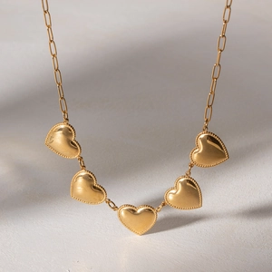 Golden heart pendant necklace with paperclip chain and polished finish for women