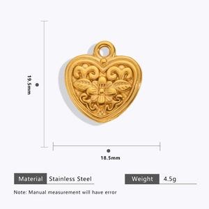 Detail of 18k gold plated heart pendant with floral texture and dimension specs