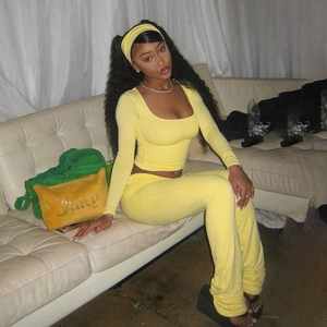 Detail of yellow knit three-piece set with square neck top, flared pants and headband