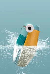 Detail showing the leak-proof seal of the cartoon toucan water bottle amidst water splashes