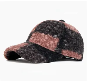 Close-up of pink and black checkered faux fur fabric texture on this baseball cap