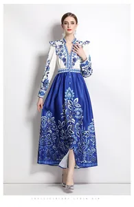 Detail of V-neck and decorative buttons on a blue and white porcelain print dress