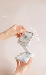Portable folding USB fan with 180-degree adjustable head showing manual tilting detail