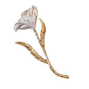 Minimalist silver tulip brooch with pleated texture and golden stem on white background