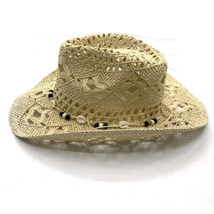 Detail showing hollow weave texture and ethnic bead band with shells on straw cowboy hat