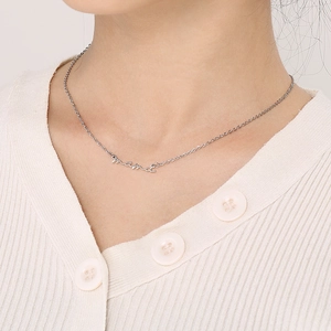 Elegant silver Mama script pendant necklace worn by a model to show collarbone fit