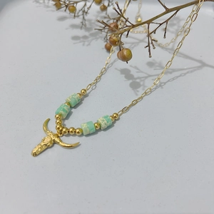 Bohemian gold stainless steel necklace with bull head pendant and light green natural stones