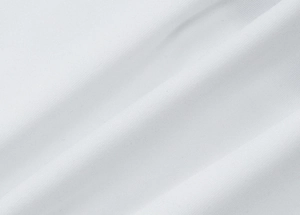 Close-up detail of white knitted fabric texture showing wave-like folds and soft material