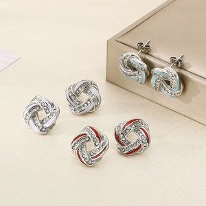 Elegant twisted earrings with crystals and colorful enamel in blue, white and red