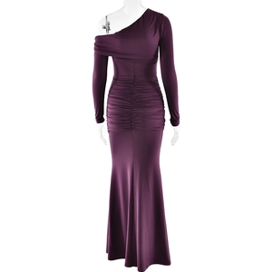 Detail of purple one-shoulder evening gown featuring ruched fabric and fishtail hem